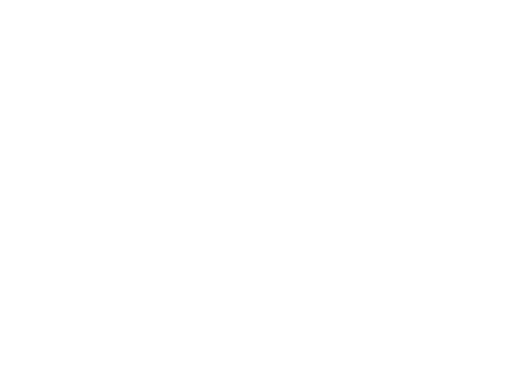 Image of a person dancing on stage with colorful lights, holding a microphone, engaging in a lively performance.